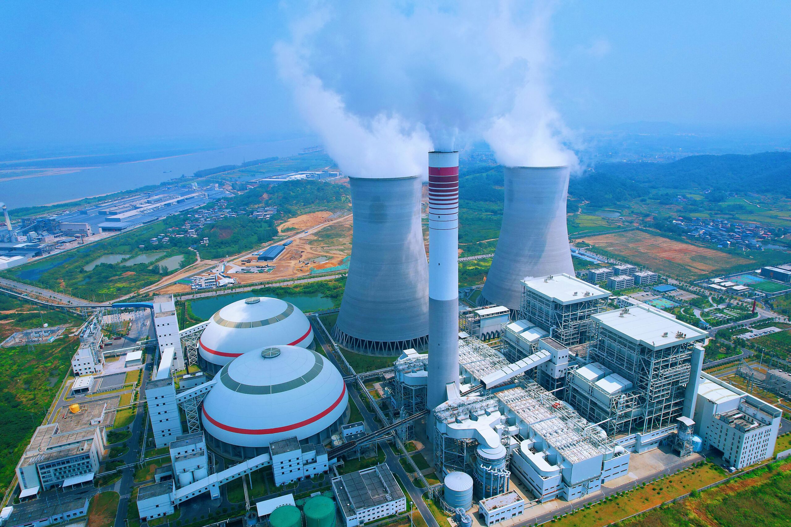 Factory emissions representing environmental impact, relevant to climate finance discussions