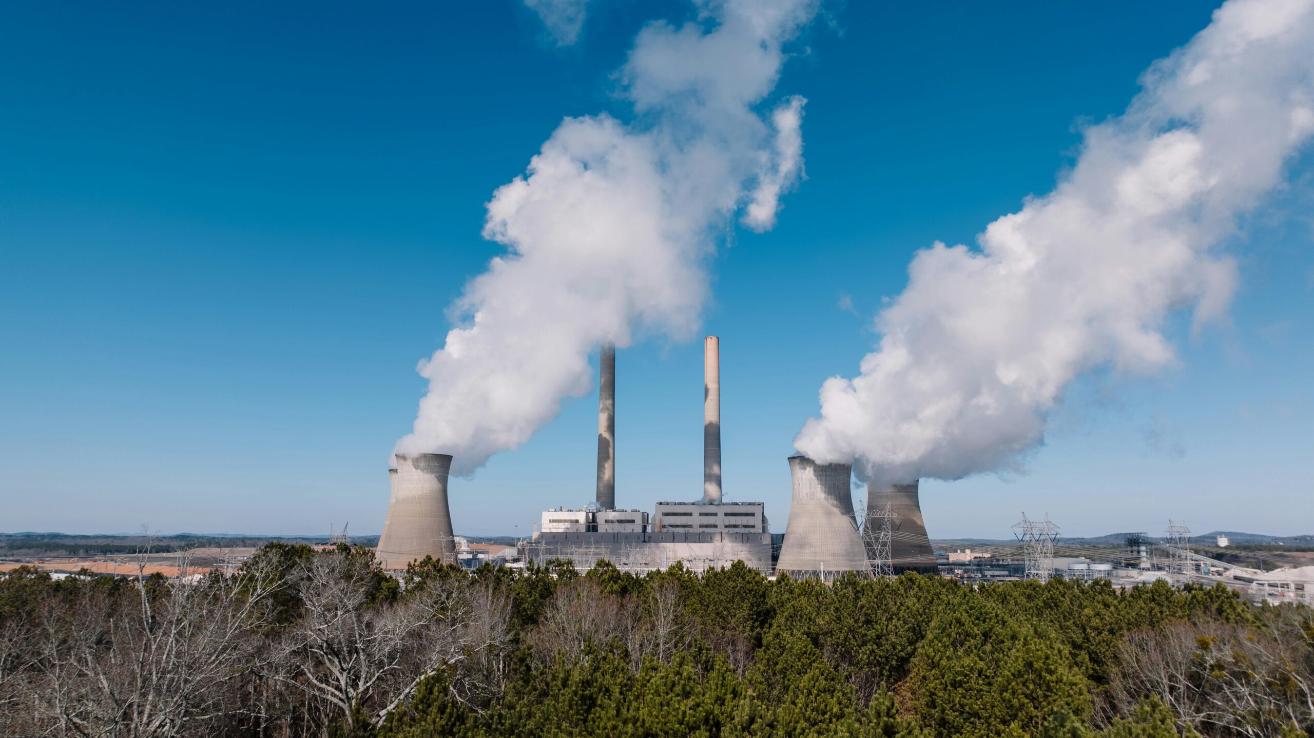 Factory smoke representing emissions in India’s carbon market